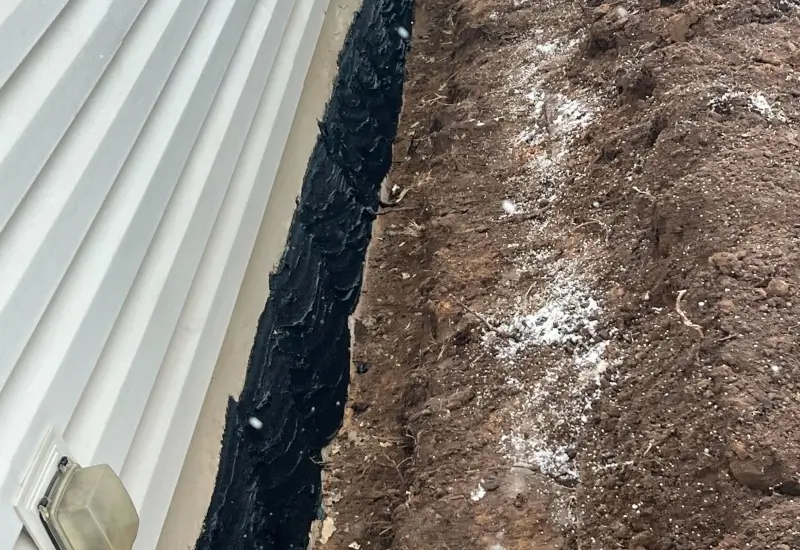 Close-up of exterior wall waterproofing in Brillion, WI