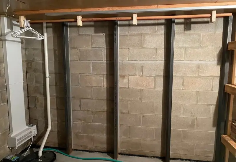 Interior basement wall with support pillars in Kronenwetter, WI